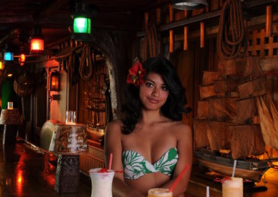 Sarong clad Mai-Kai maiden presents signature cocktails along the nautical themed Molokai bar.