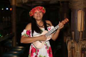 Rosemarie - a female musician playing her ukulele in the Molokai Bar.