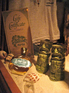Gift shop items displayed in a sand filled show case.