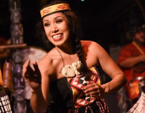 A female Polynesian dancer dressed in the Maori costume performing on Mai-Kai’s stage.