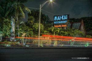The Mai-Kai sign on Federal Highway illuminated at night.