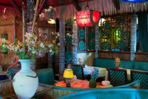 Close up view of the Tahiti dining room's many authentic artifacts and decor.